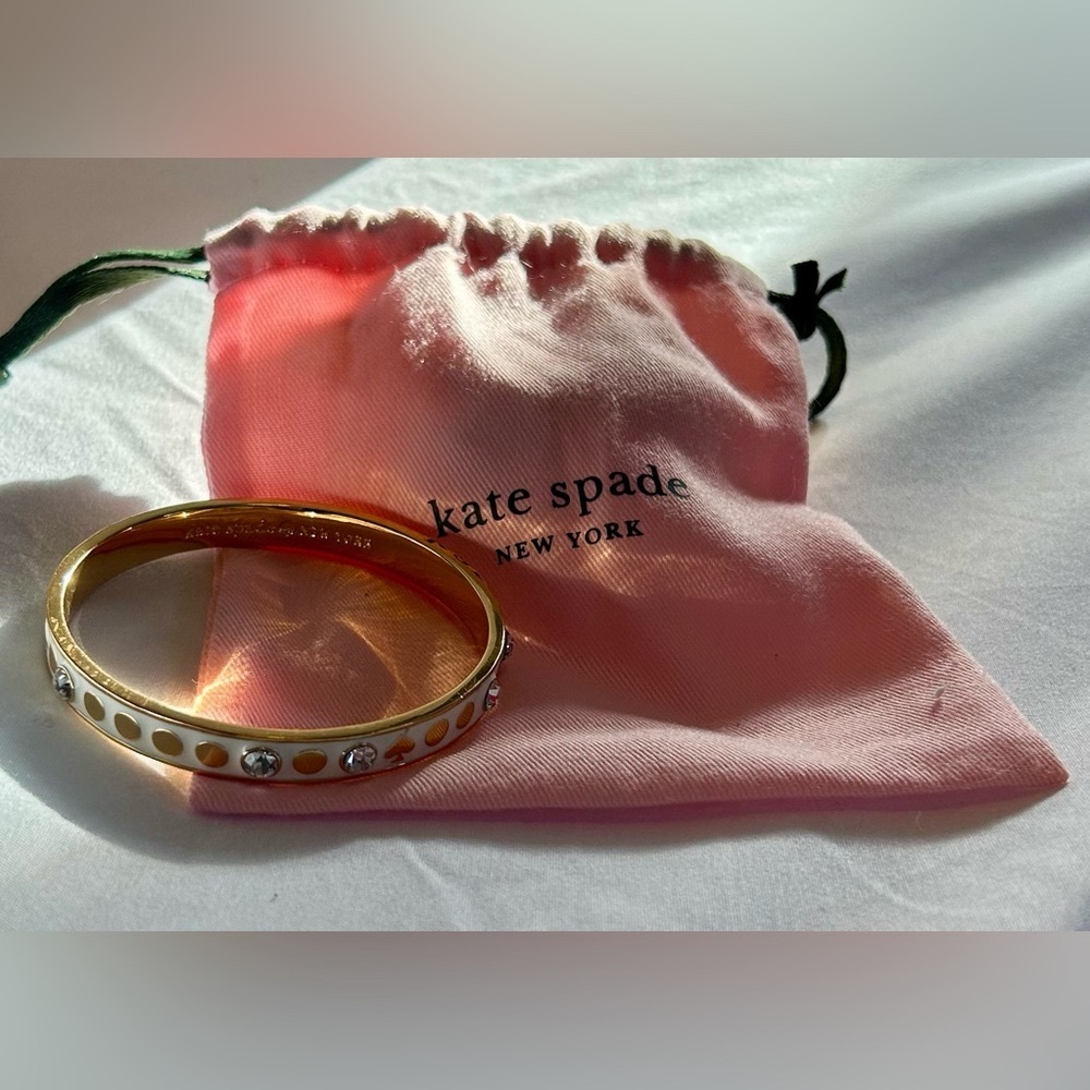 KATE SPADE gold and White Enamel Bangle bracelet. Excellent cond- with pouch!